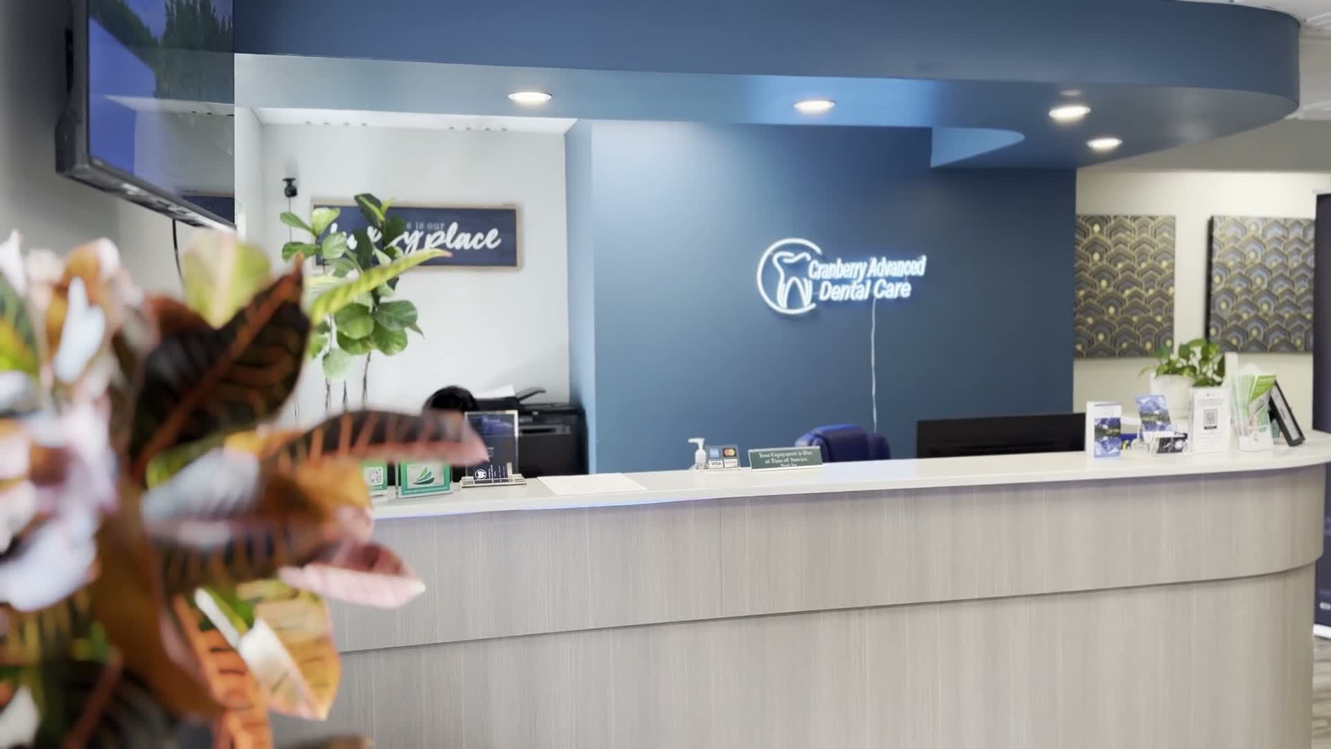 Reception desk and welcome area at Cranberry Advanced Dental Care